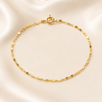 Add a bold yet refined touch to your wrist with our 18k Gold Filled Flat Ladder Bracelet. Designed with smooth, wide-set horizontal links that catch the light effortlessly, this piece delivers a modern geometric silhouette and a comfortable, fluid fit. Perfect for elevating a stack or making a minimalist statement on its own.