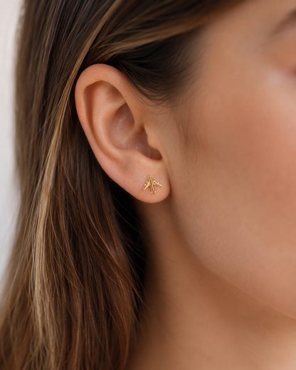 Carry the spirit of adventure. Our 18k Gold Filled airplane studs are hypoallergenic, waterproof, and travel-proof. The perfect 0.27" (0.7cm) gift for the modern jet-setter. Shop Nosso Galeon.