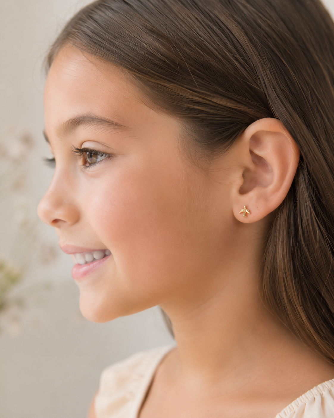 The perfect gift for little travelers. Our 18k Gold Filled airplane studs are hypoallergenic, waterproof, and durable for active kids. Shop Nosso Galeon.