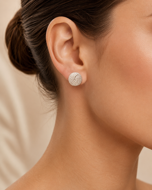 Handcrafted filigree knot stud earrings in Colombian 925 sterling silver. Traditional woven design made by hand in Santa Fe de Antioquia